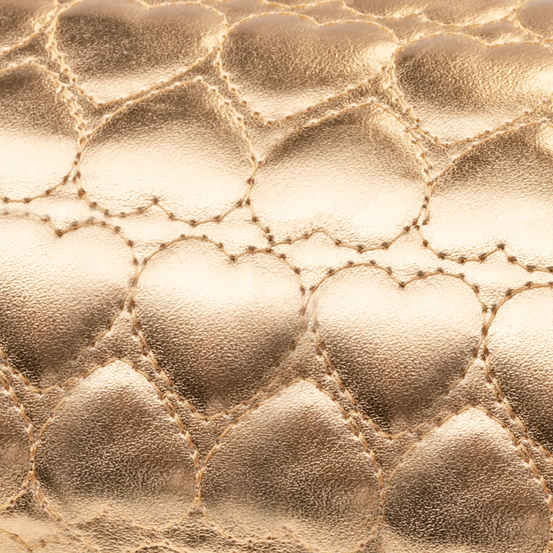 COJÍN MANICURA DORADO